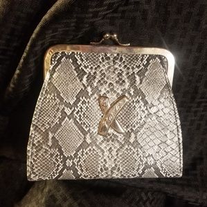 Small snakeskin print clutch made by Roma